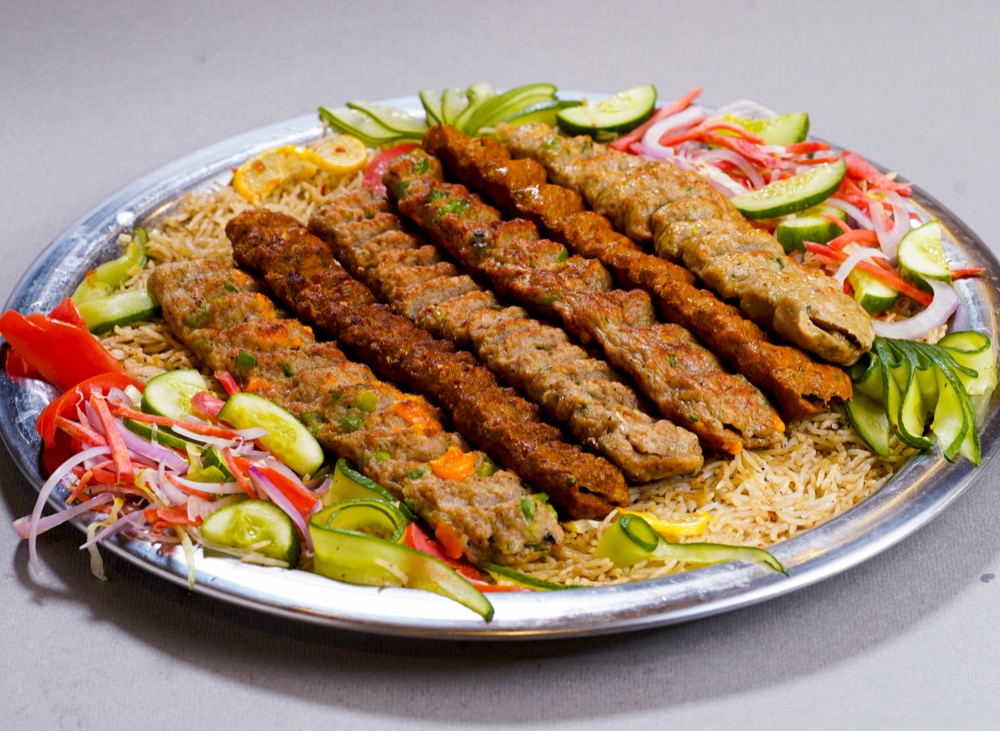Sufraq Kebab Royal, a platter of charcoal-grilled kebabs over seasoned rice